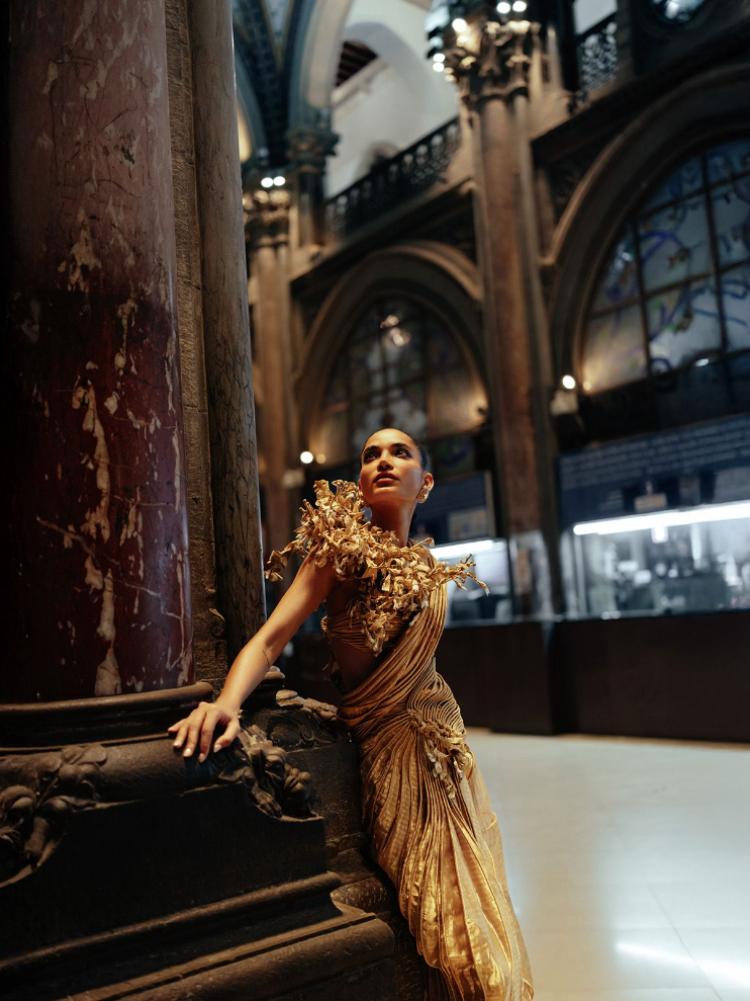 A model in a blouse with coral cords and silk sari by Indian designer Vaishali S