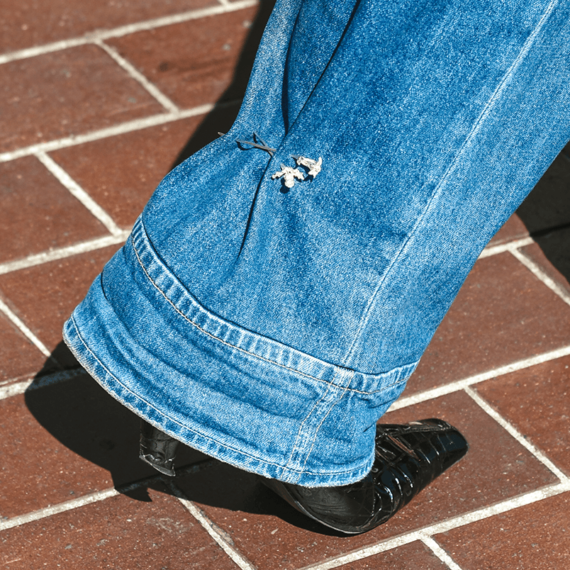 The Ouze's Thistle pin (Aetla, Edinburgh exlusive), Trillium pin (Grays, Toronto exclusive) on jeans