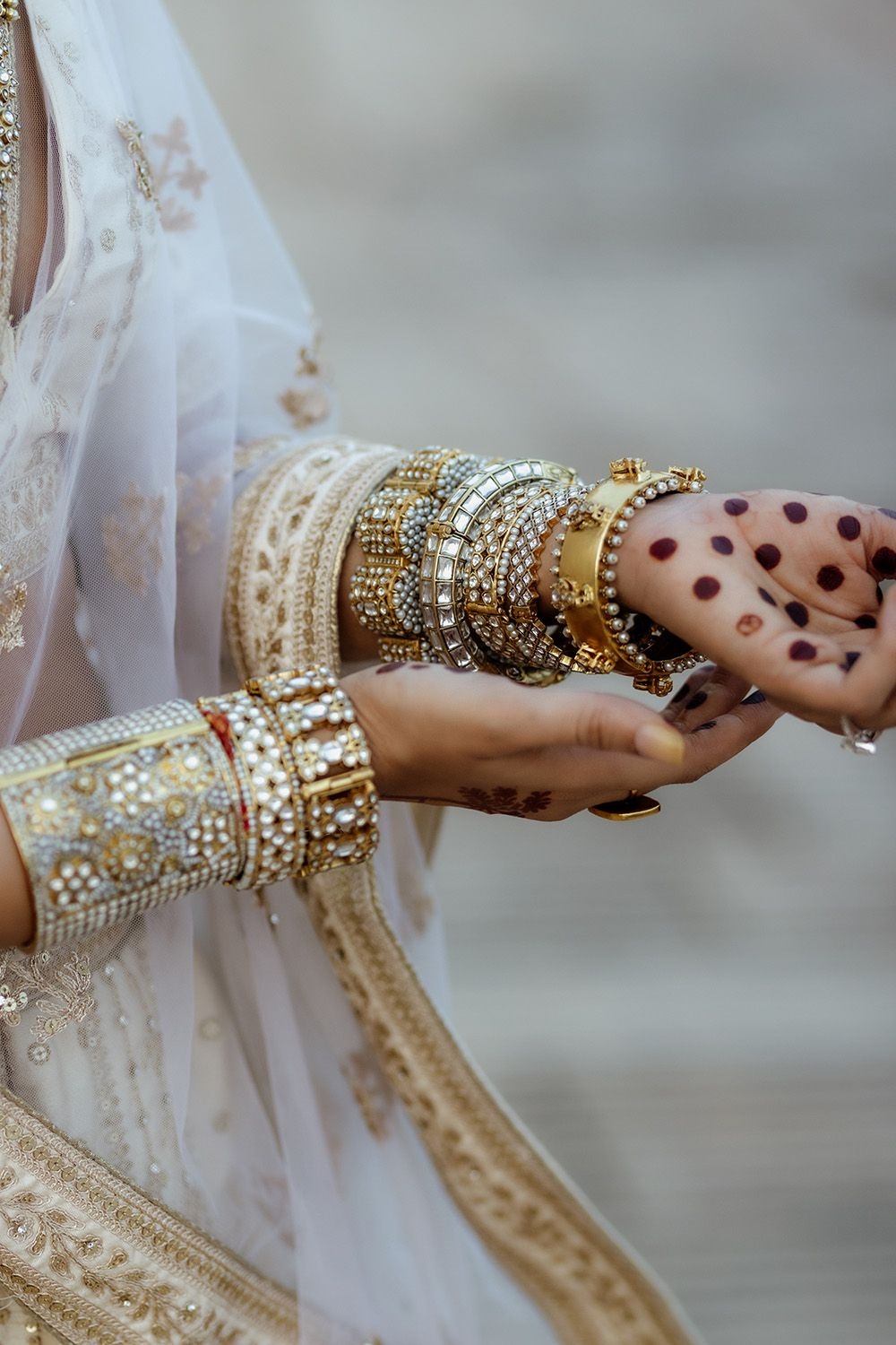 A close-up for the bangles and cuff Aavriti Jain of Dhora wore for her wedding at Rambagh Palace in Jaipur