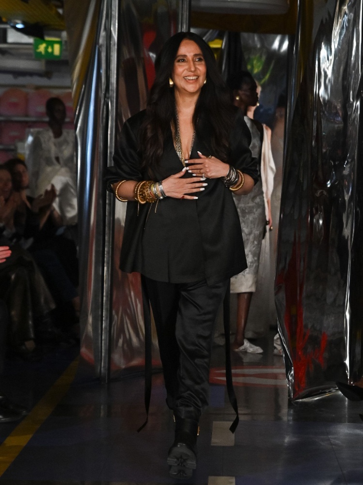 The designer Anamika Khanna takes a bow at the close of her show