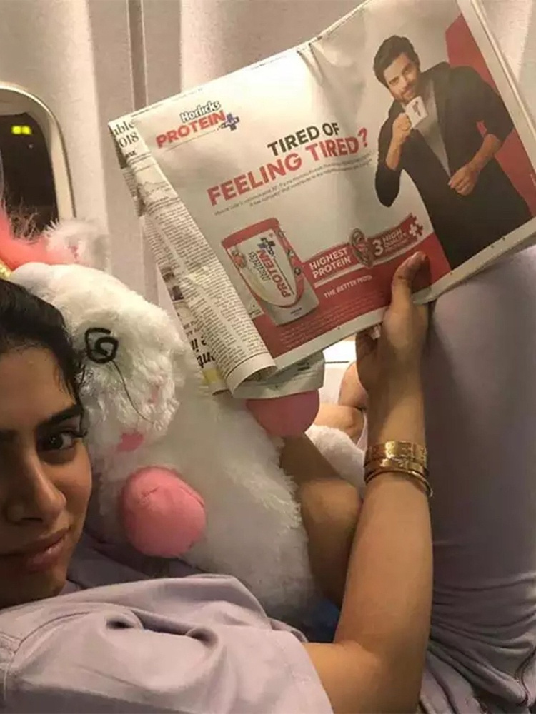 Khushi Kapoor in a plane holding a plush toy