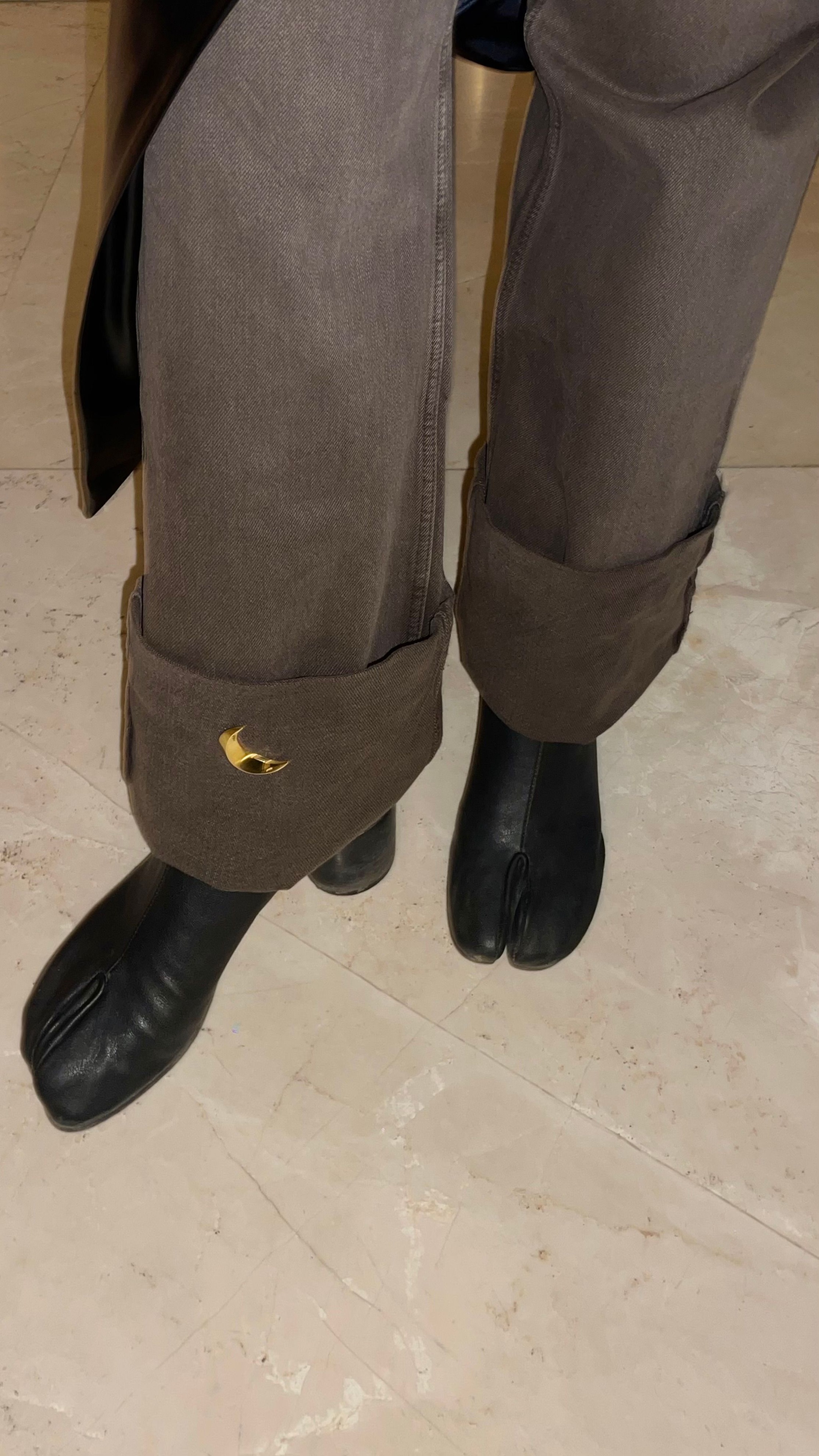 Bhaavya wearing a pair of black leather Tabi boots