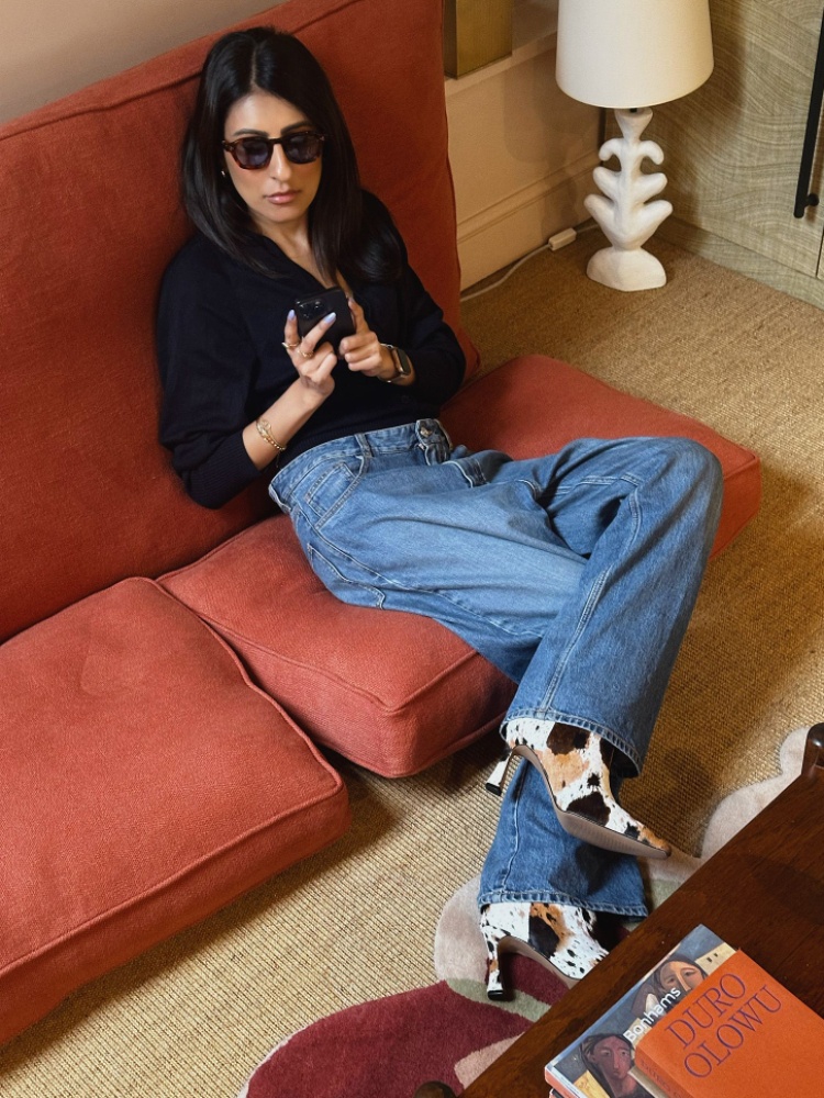 Chandni Modha in cow-print boots