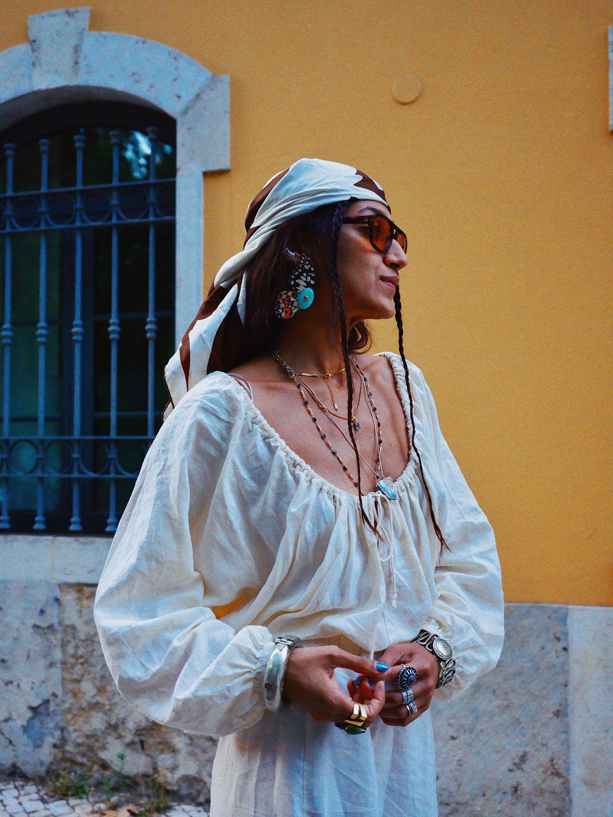 Stylist and creative director of Bodements Divya Saini wearing a Burberry scarf as a bandana