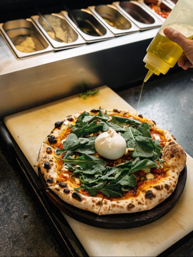 Burrata pizza with olive oil drizzle