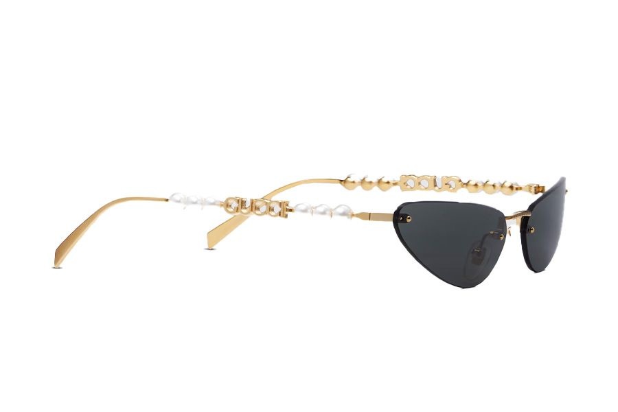 Gucci cat-eye sunglasses with a gold-toned metal frame adorned with pearls