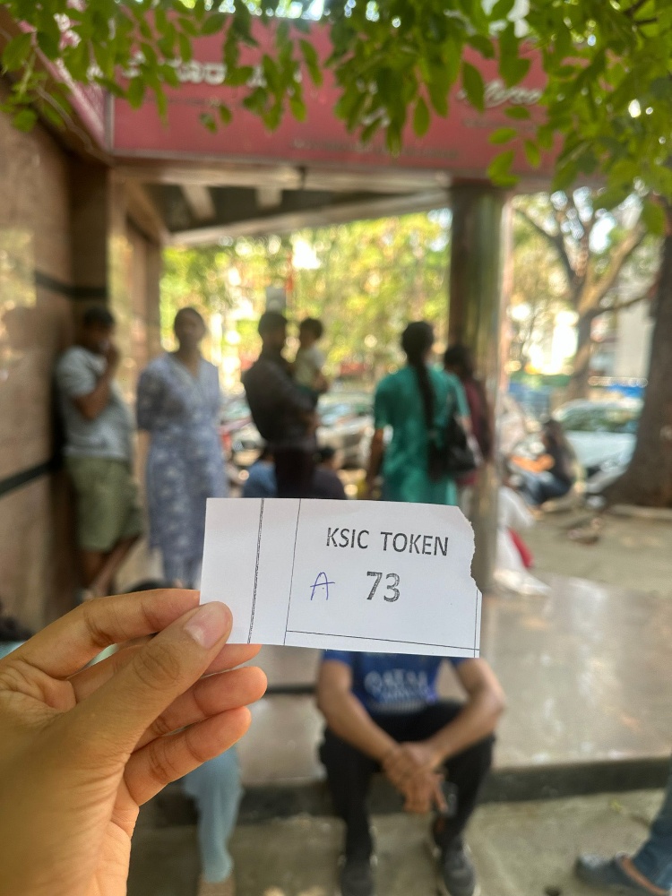 After lining up, customers get a token number to enter the store