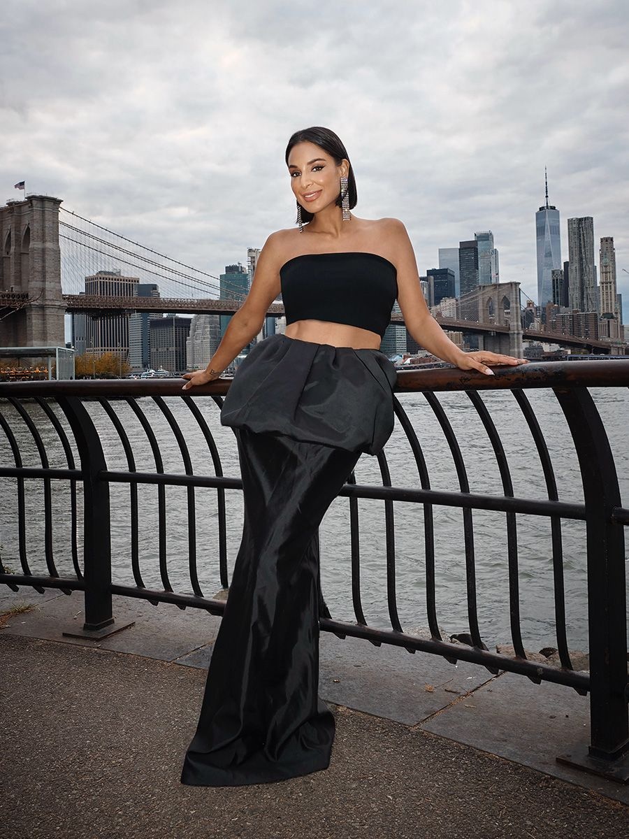 RHONY star Jessel Taank in a black top and skirt set by The New Arrivals