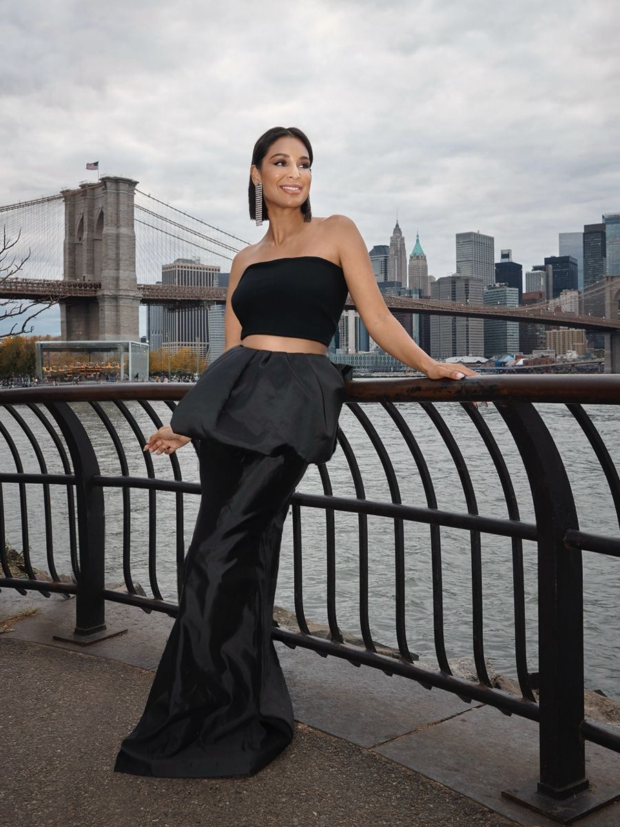 RHONY star Jessel Taank in a black top and skirt set by The New Arrivals