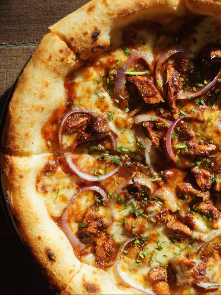 Pie with an onion and herb garnish
