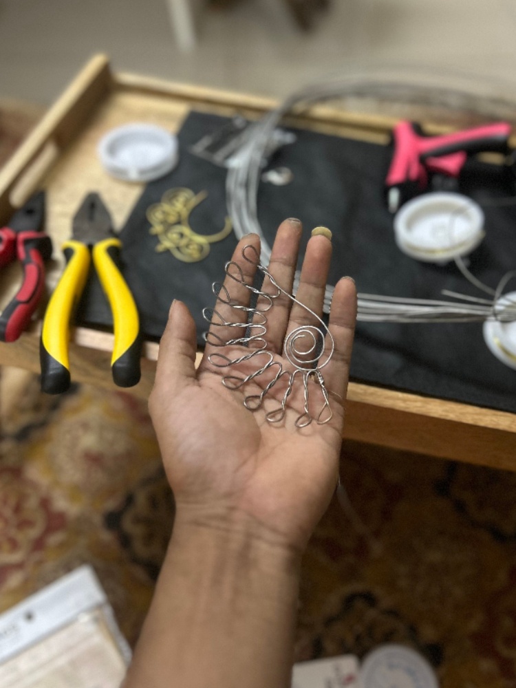 Making his ear cuffs