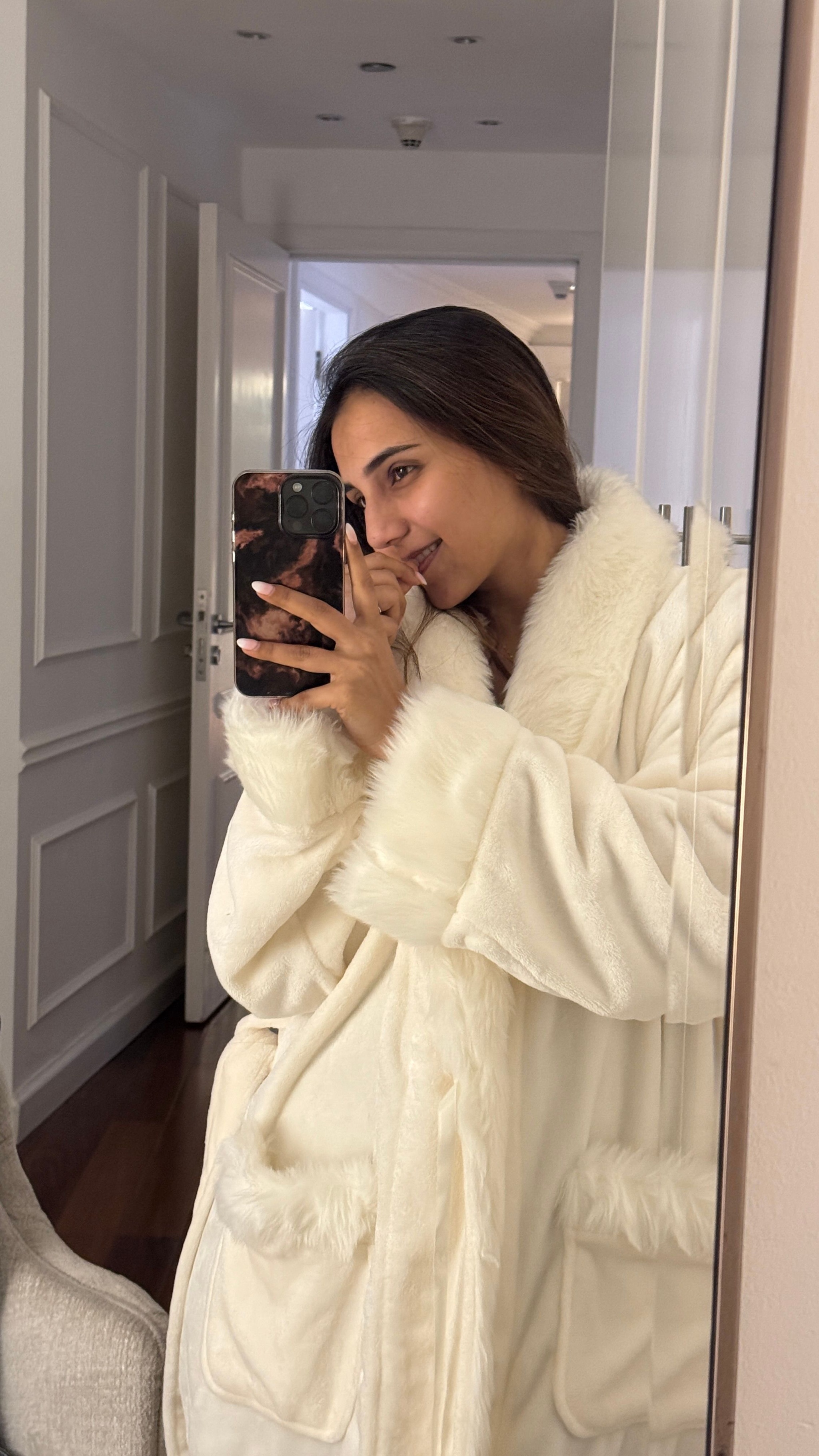 Influencer Masoom Minawala shares her wind down routine. Here, she wears a fluffy bathrobe.