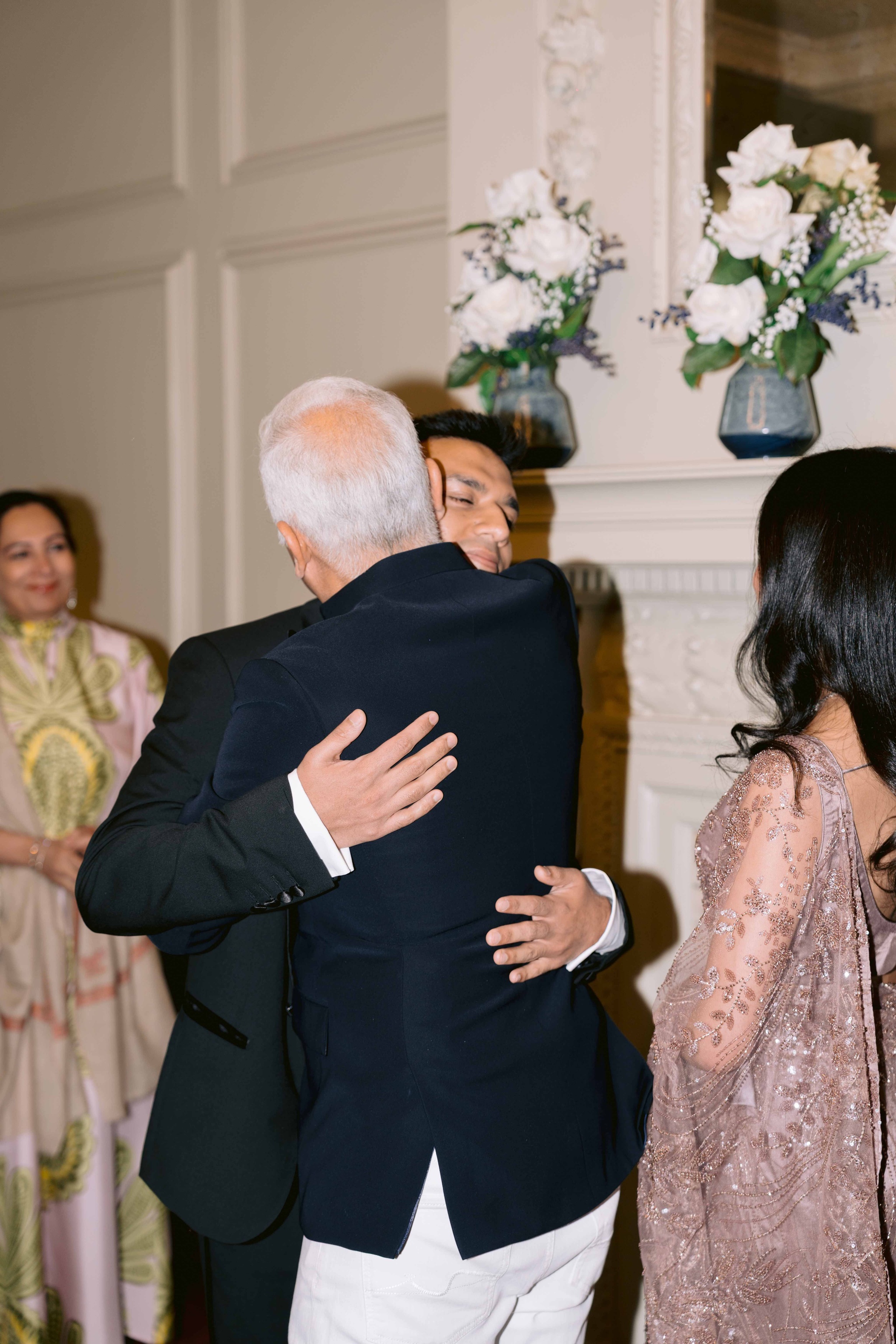 Ash Miah hugging the bride's father
