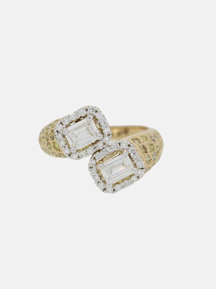 A double stone ring with emerald cut diamonds and a diamond halo by Moi