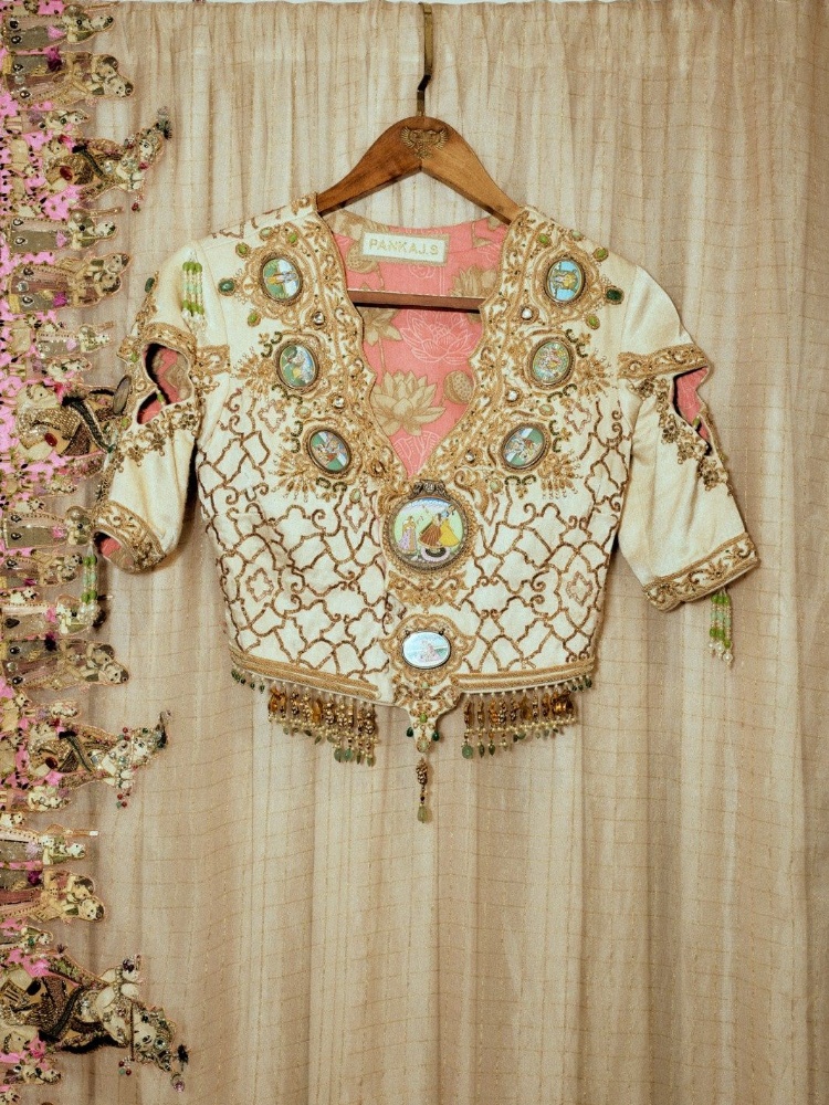 An ornate Pankaj Heritage blouse featuring miniature paintings