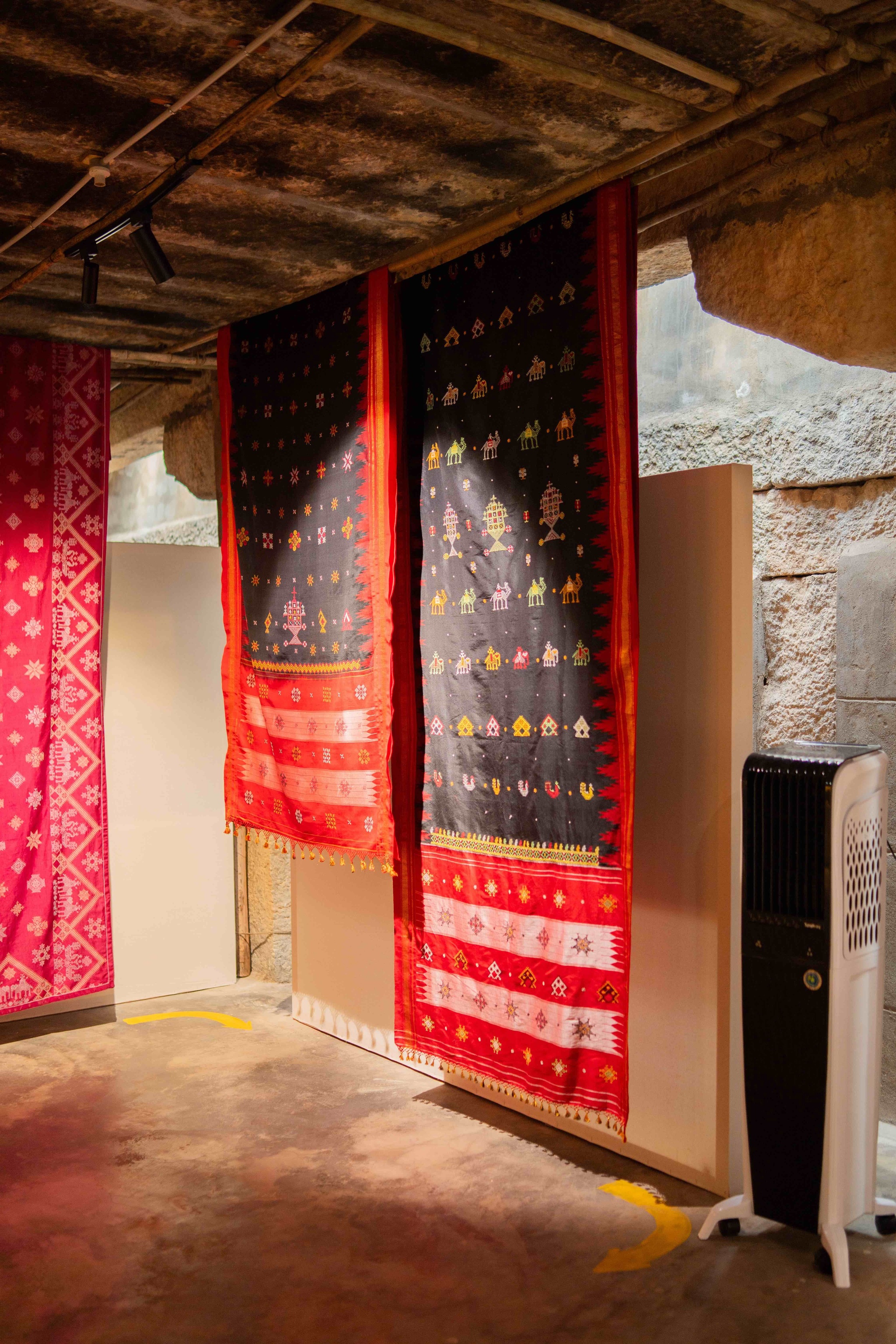 Installation view of ek-taar and do-taar chandrakali saris
