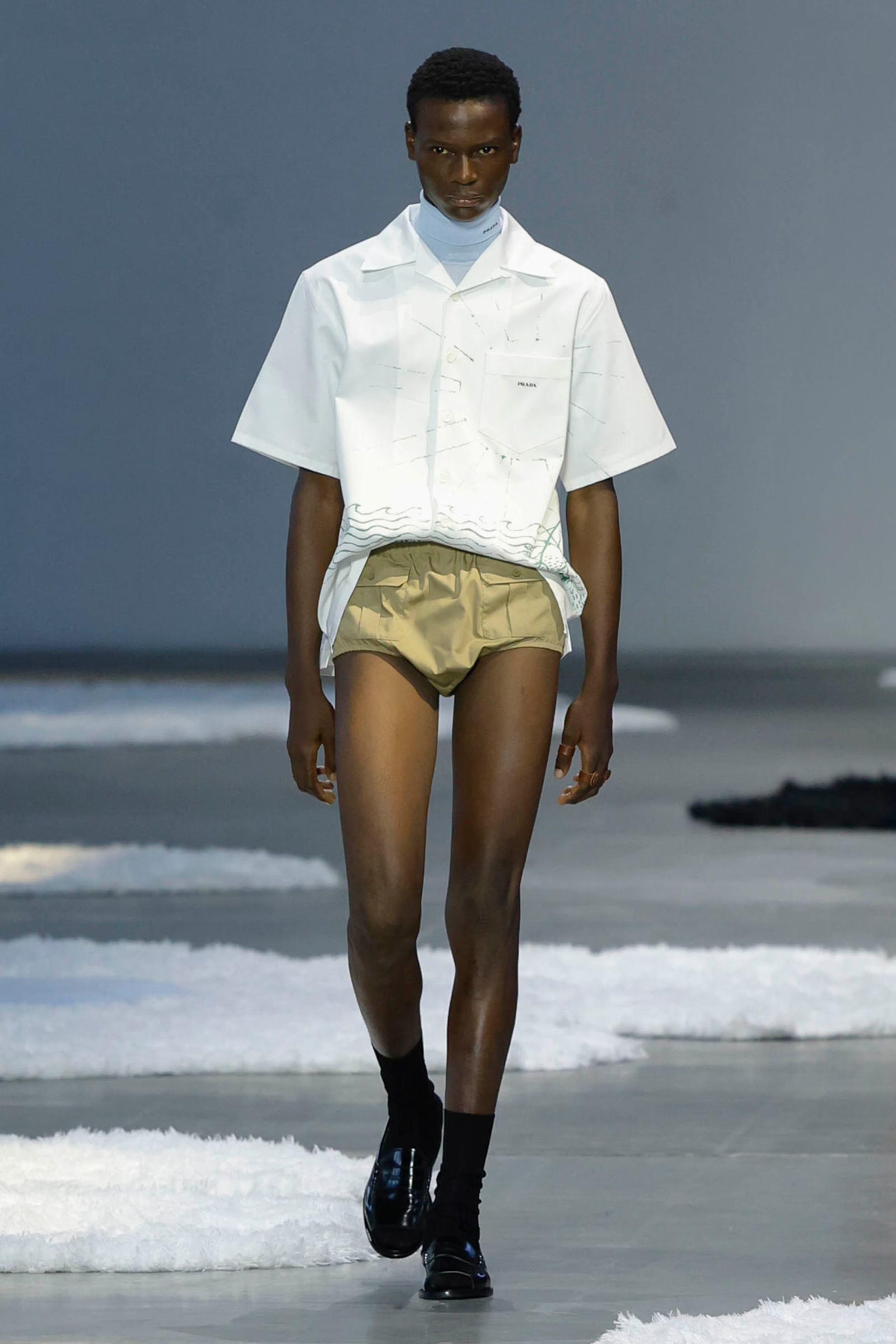 A Prada Men's SS26 look featuring bloomer-like shorts, The Nod Mag