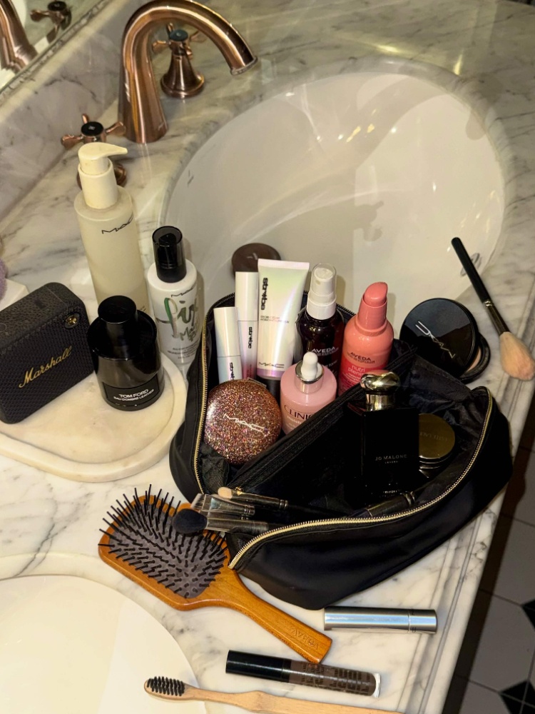 He keeps M.A.C's Glow Play lip balm. Fix+ hydrating mist and Tom Ford mini perfumes handy, along with a bamboo toothbrush for his eyebrows and beard