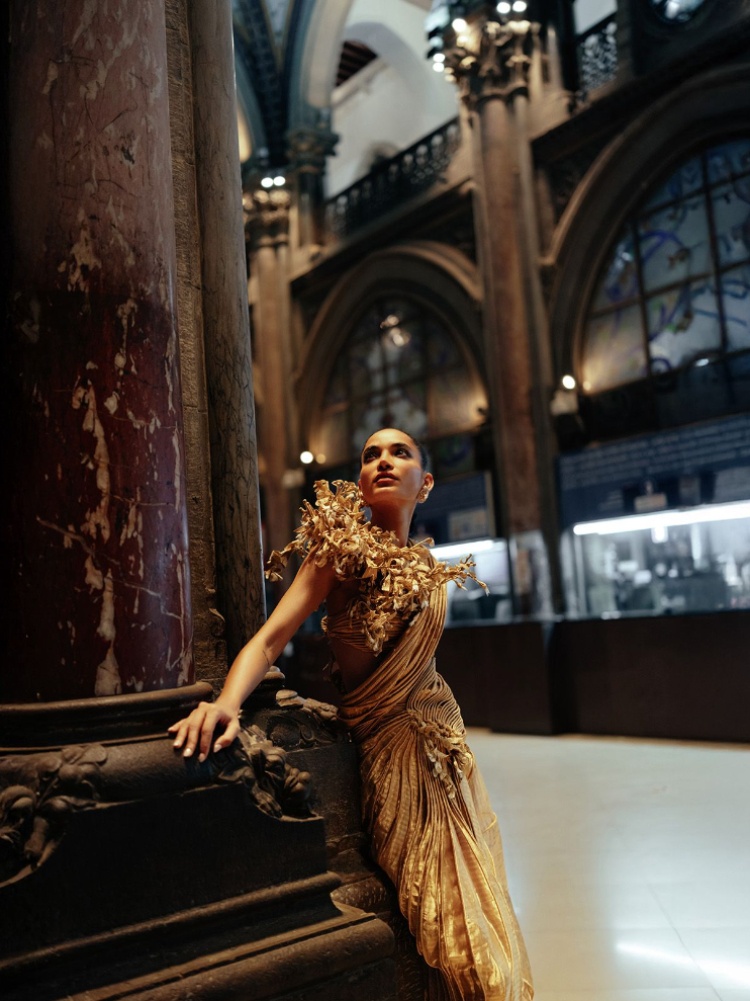 A model in a blouse with coral cords and silk sari by Indian designer Vaishali S