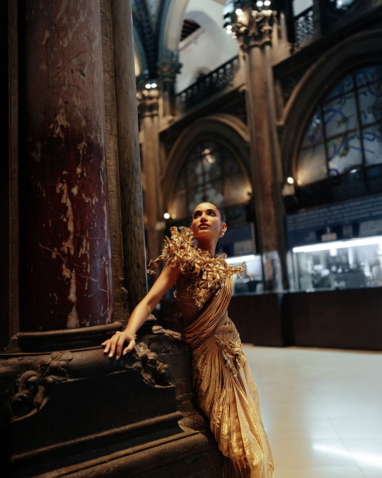 A model in a blouse with coral cords and silk sari by Indian designer Vaishali S