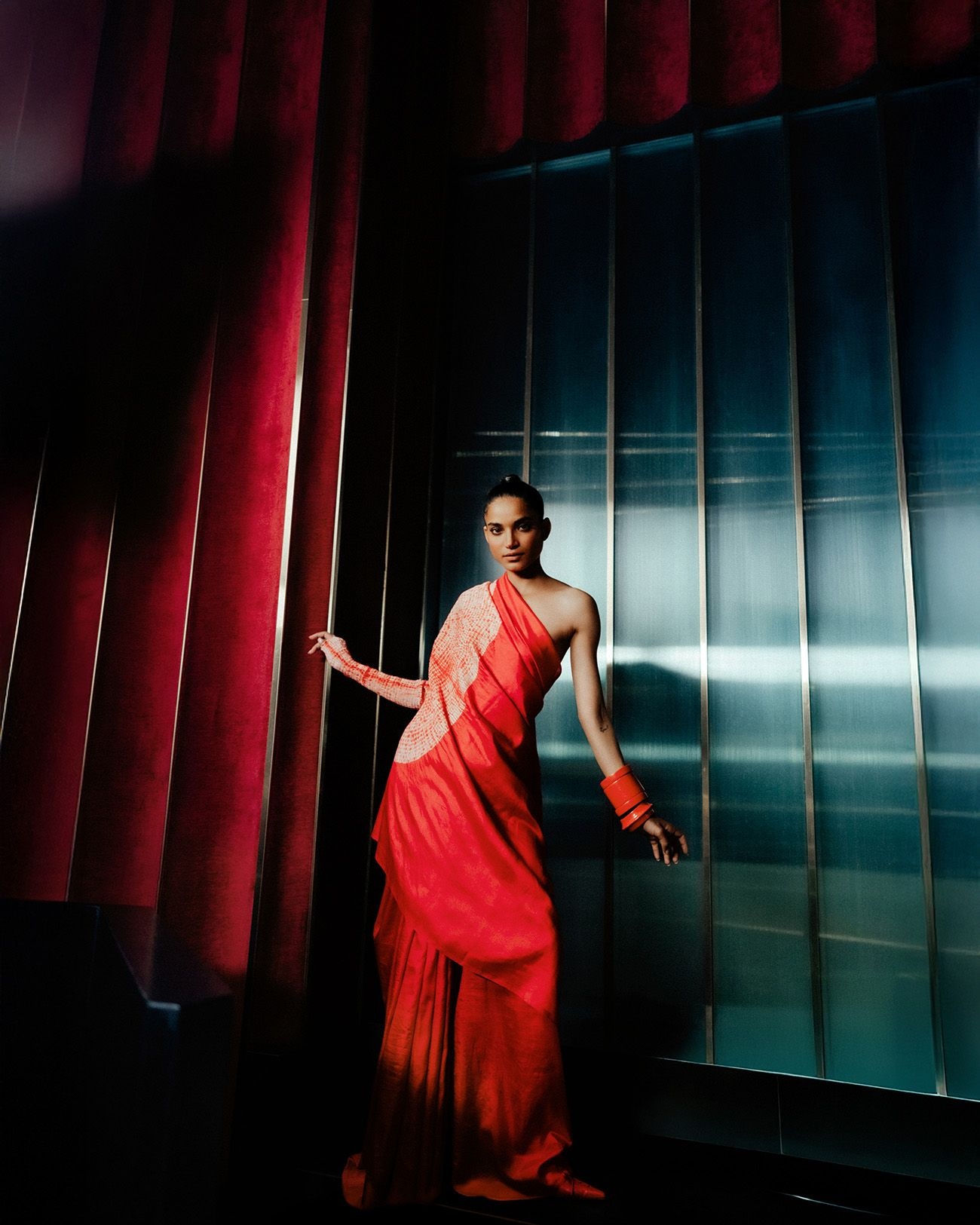 A model poses in the liquid handsfree sari by Studio Medium and Radhika Agarwal bangles