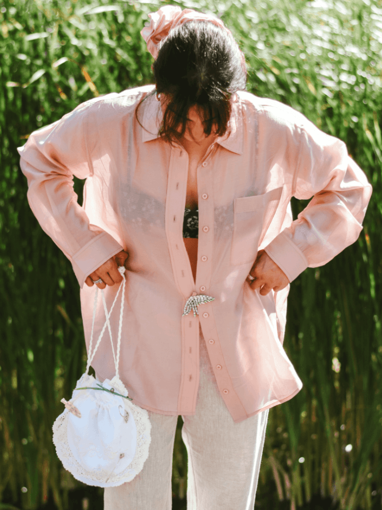 Brooches worn on a shirt and a bag