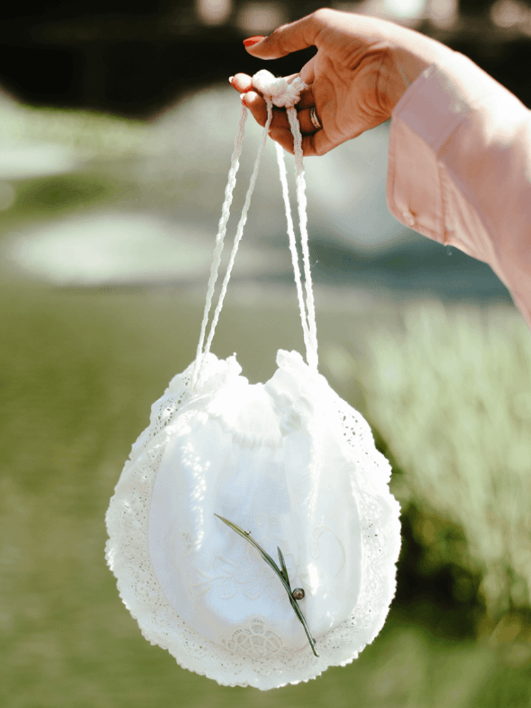 Pearl Glades of Glass brooch by Anabela Chan styled on a bag