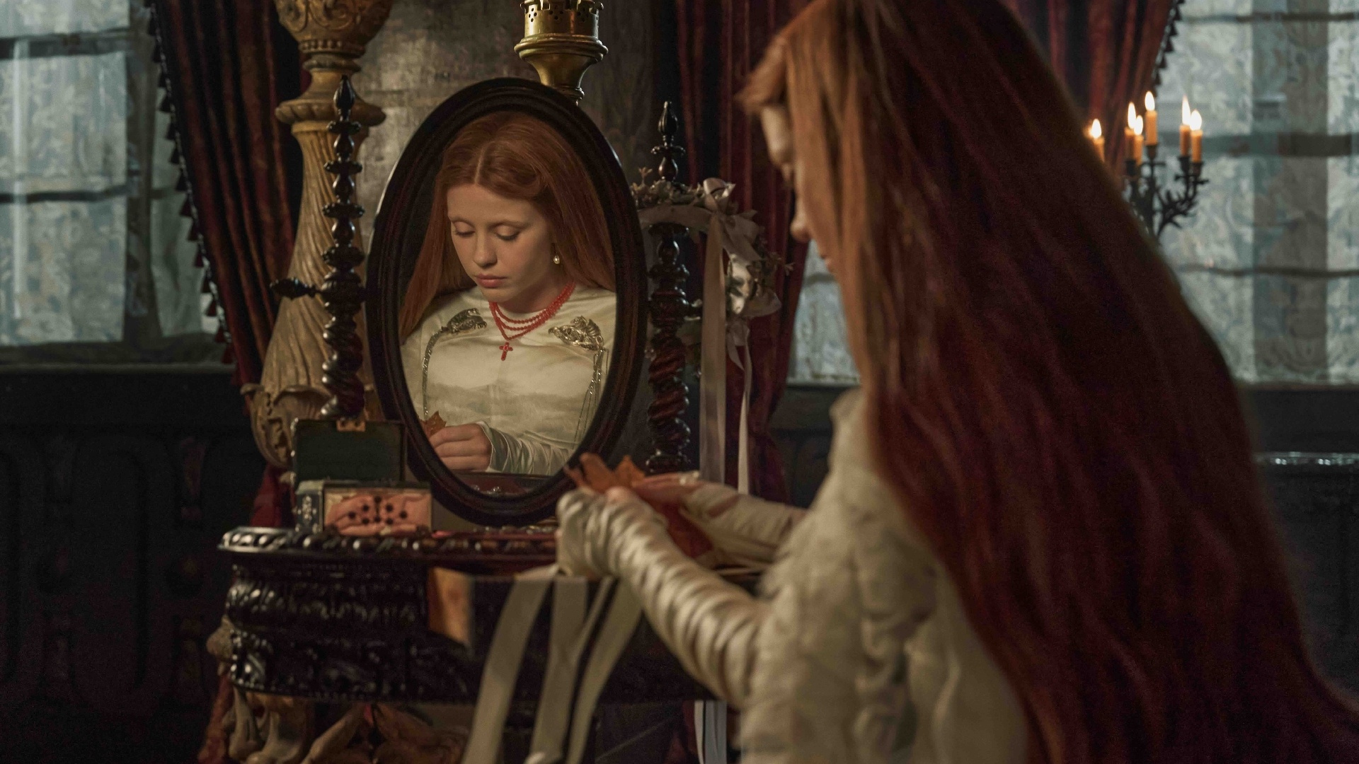 Mia Goth wears a custom Tiffany & Co rosary in a still from ‘Frankenstein’