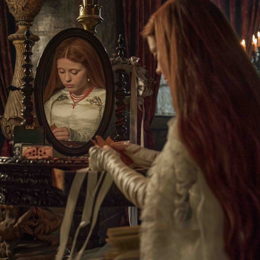 Mia Goth wears a custom Tiffany & Co rosary in a still from ‘Frankenstein’