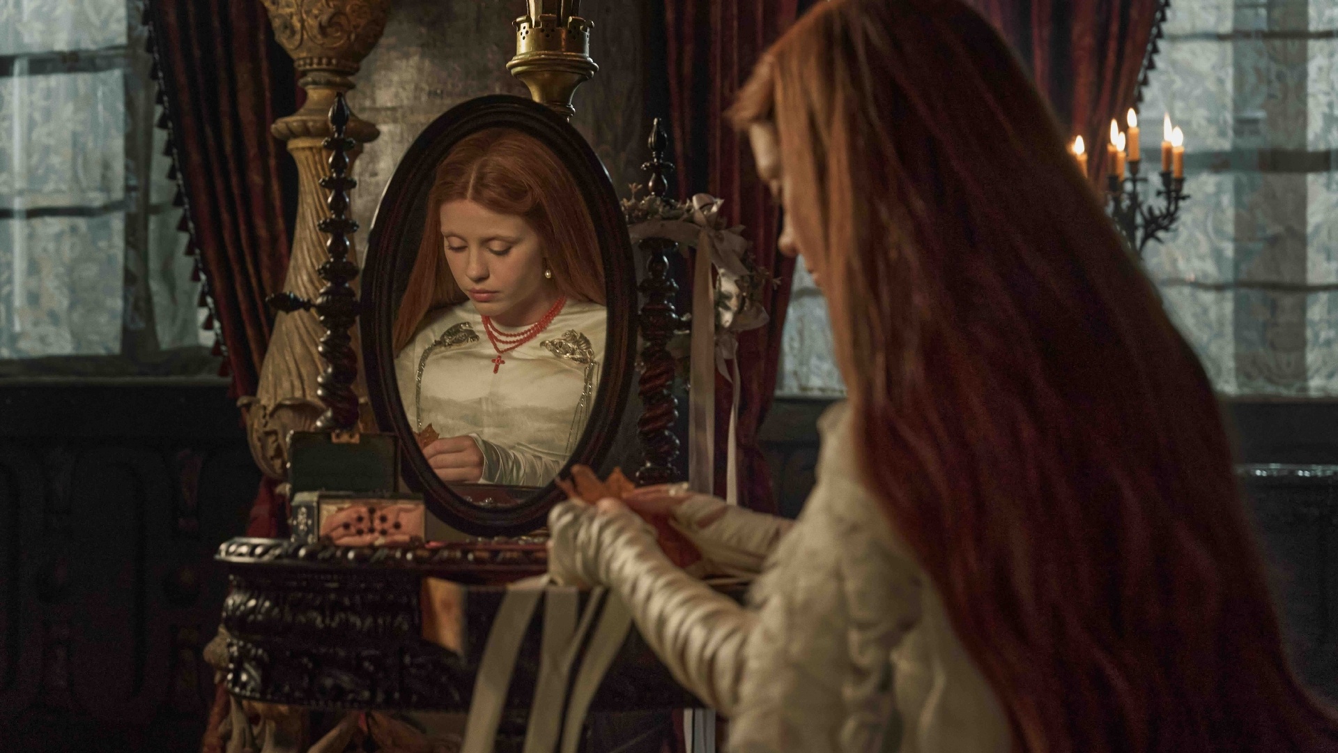 Mia Goth wears a custom Tiffany & Co rosary in a still from ‘Frankenstein’