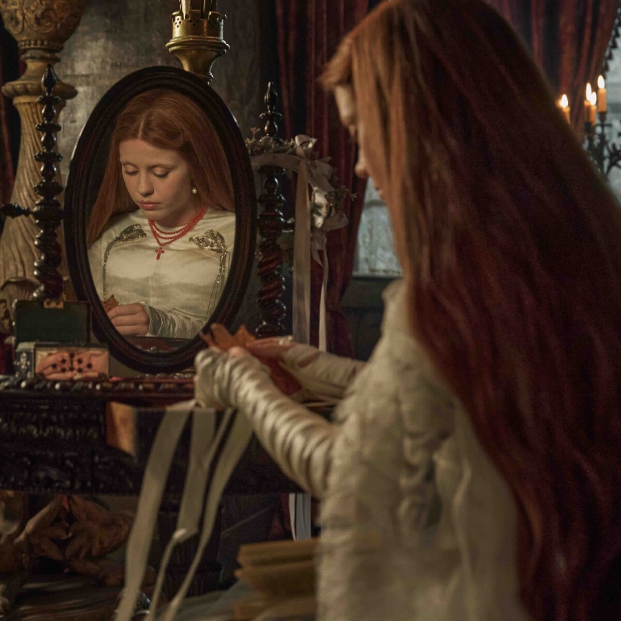 Mia Goth wears a custom Tiffany & Co rosary in a still from ‘Frankenstein’