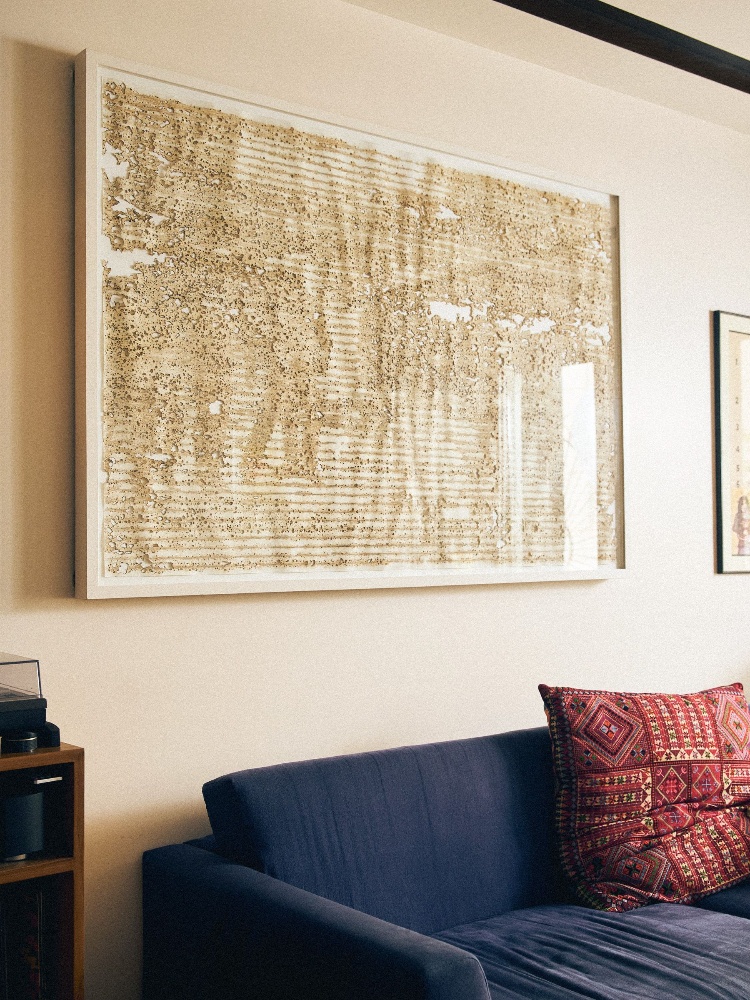 Artworks and colourful upholstery decorate the space