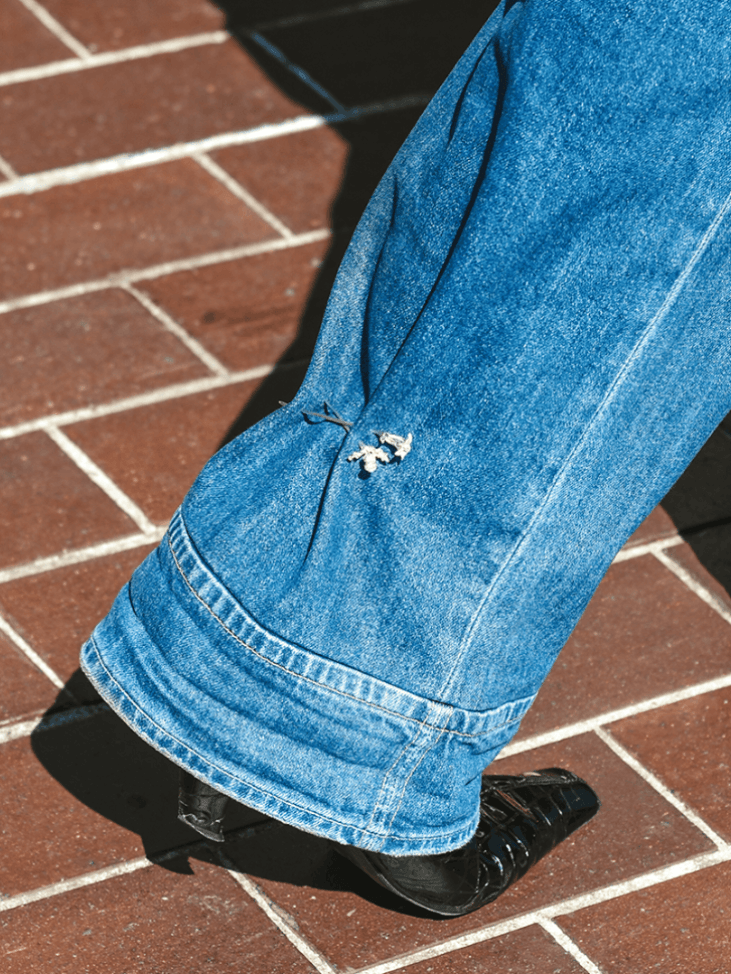 The Ouze's Thistle pin (Aetla, Edinburgh exlusive), Trillium pin (Grays, Toronto exclusive) on jeans