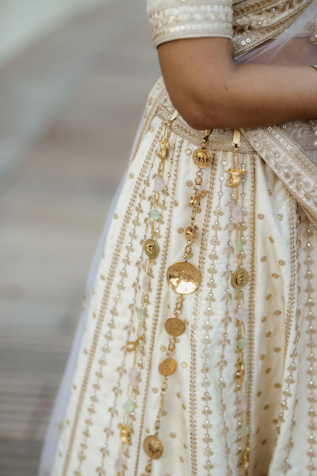 Clip-on lehenga accessories by Dhora worn by Aavriti Jain for her wedding