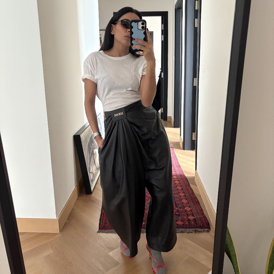 Stylist Amrita Singh in a white t-shirt and Loewe leather pants