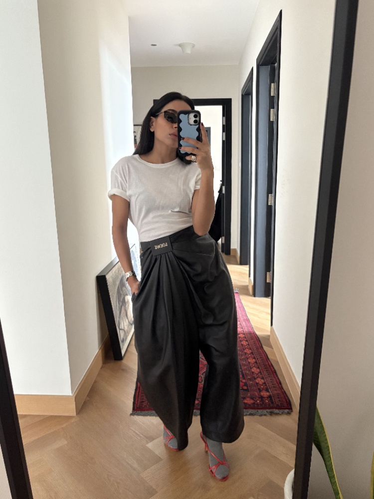 Stylist Amrita Singh in a white t-shirt and Loewe leather pants