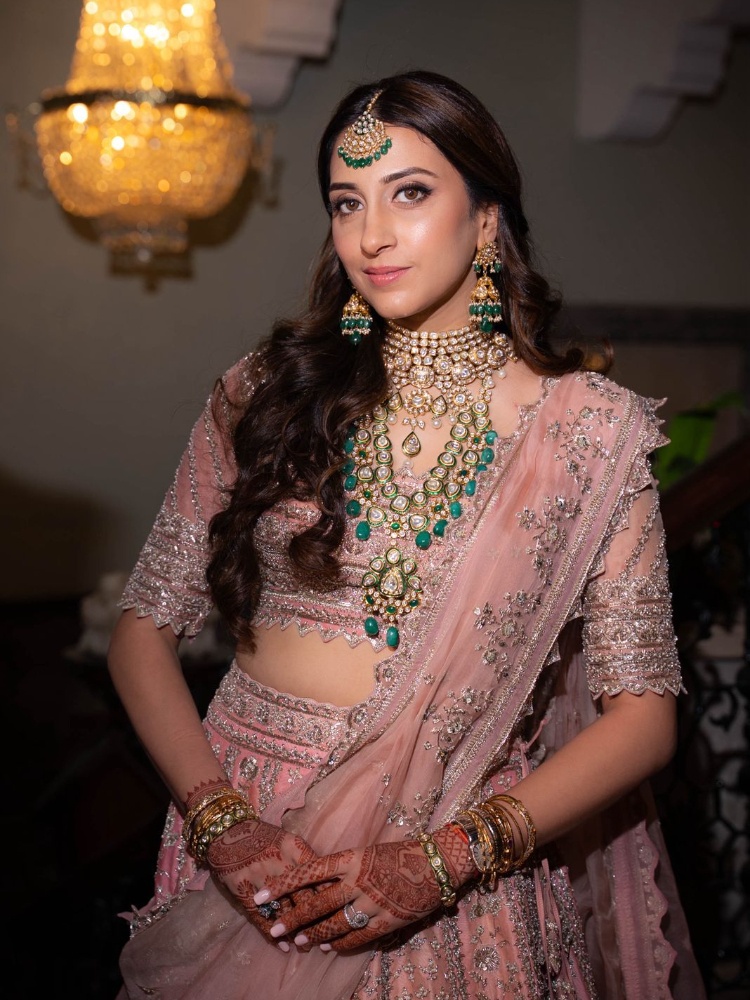 Anissa Malhotra Jain rewearind an emerald and polki diamond set from her wedding