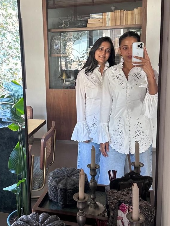 Ashmi Bhansali and Sanaa Choksi in matching shirts from the Rabanne x H&M collaboration