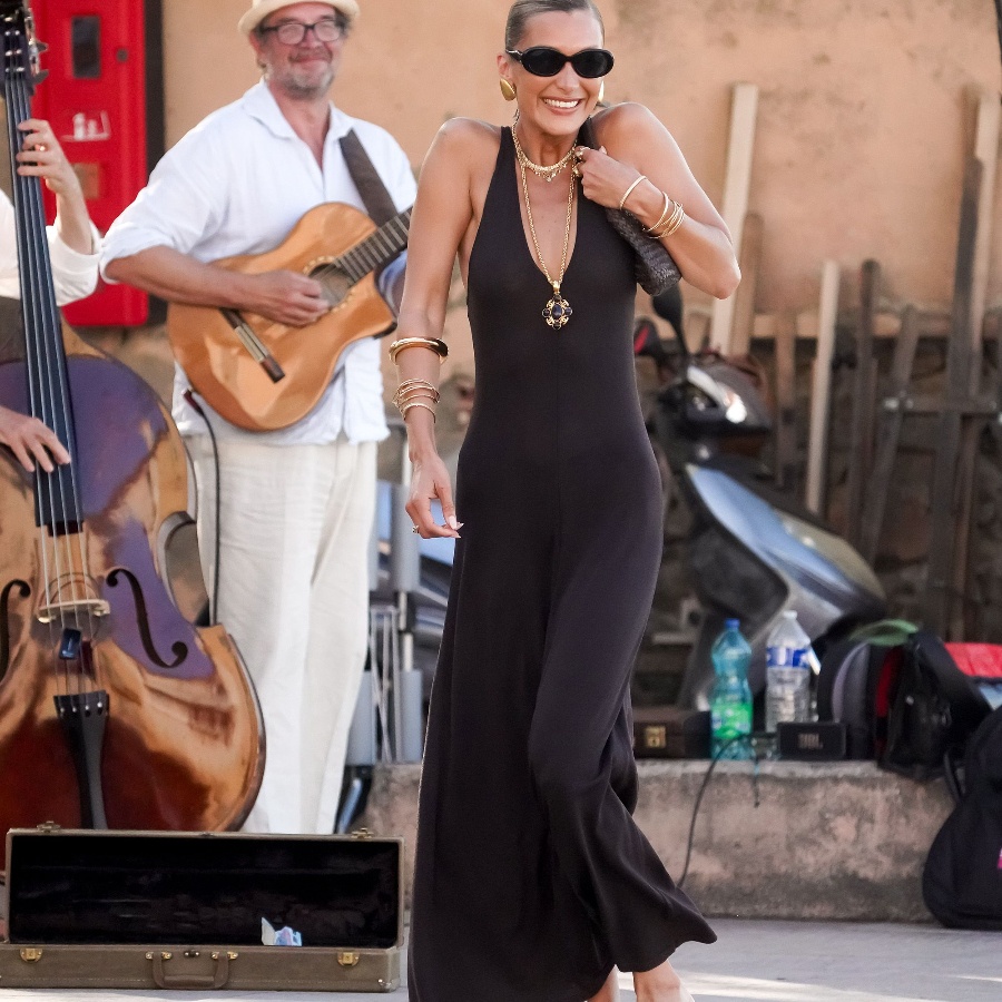 Bella Hadid in a brown dress and black leather flip flops in St Tropez