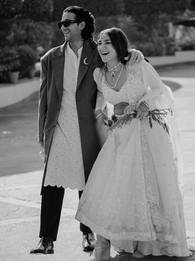 Bhaavya Bhatnagar and Rishi Baweja at their wedding reception wearing Maison Margiela Tabi boots