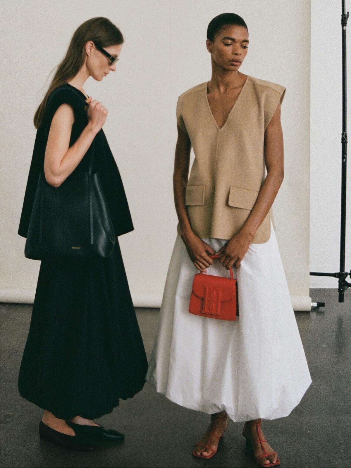 A By Malene Birger campaign photo featuring models wearing bubble skirts