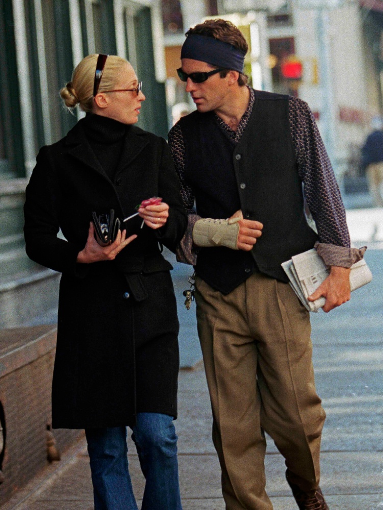 Carolyn Besette-Kennedy wearing her signature headband with JFK Jr in New York