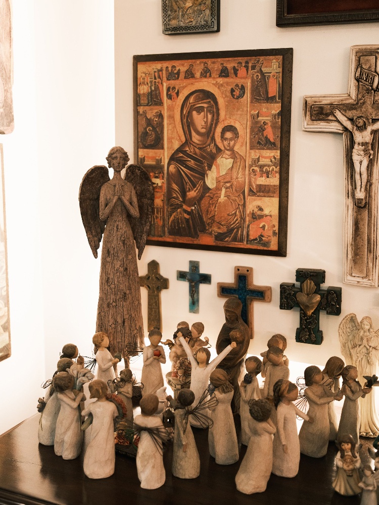 A corner in hairstylist Clarabelle Saldanha's home in Bandra, decorated with Christian iconography like crosses and angel figurines
