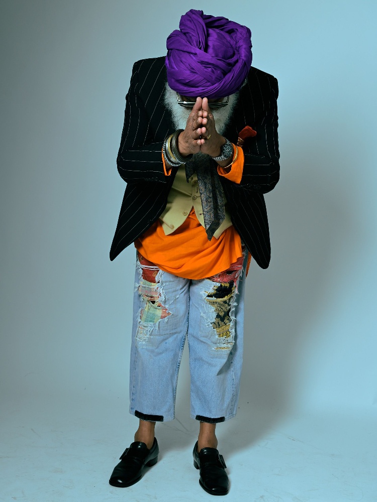 The Cockney Sikh, aka Suresh Singh in ripped jeans and a purple turban