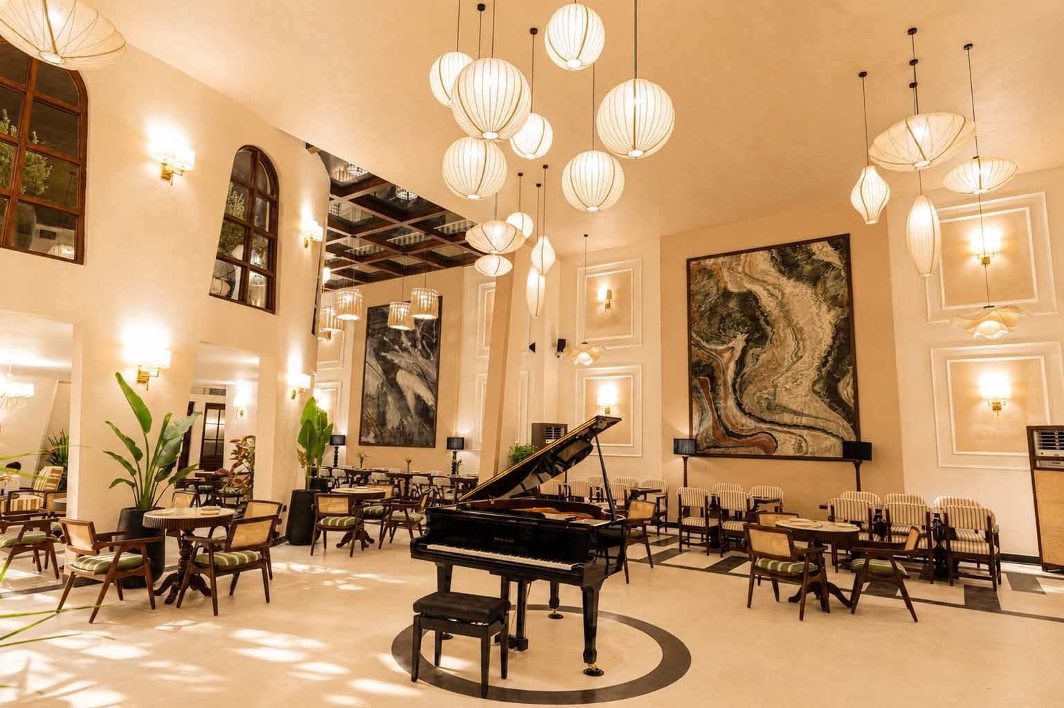 Double-height ceilings, elegant arches, and gallery-like interiors