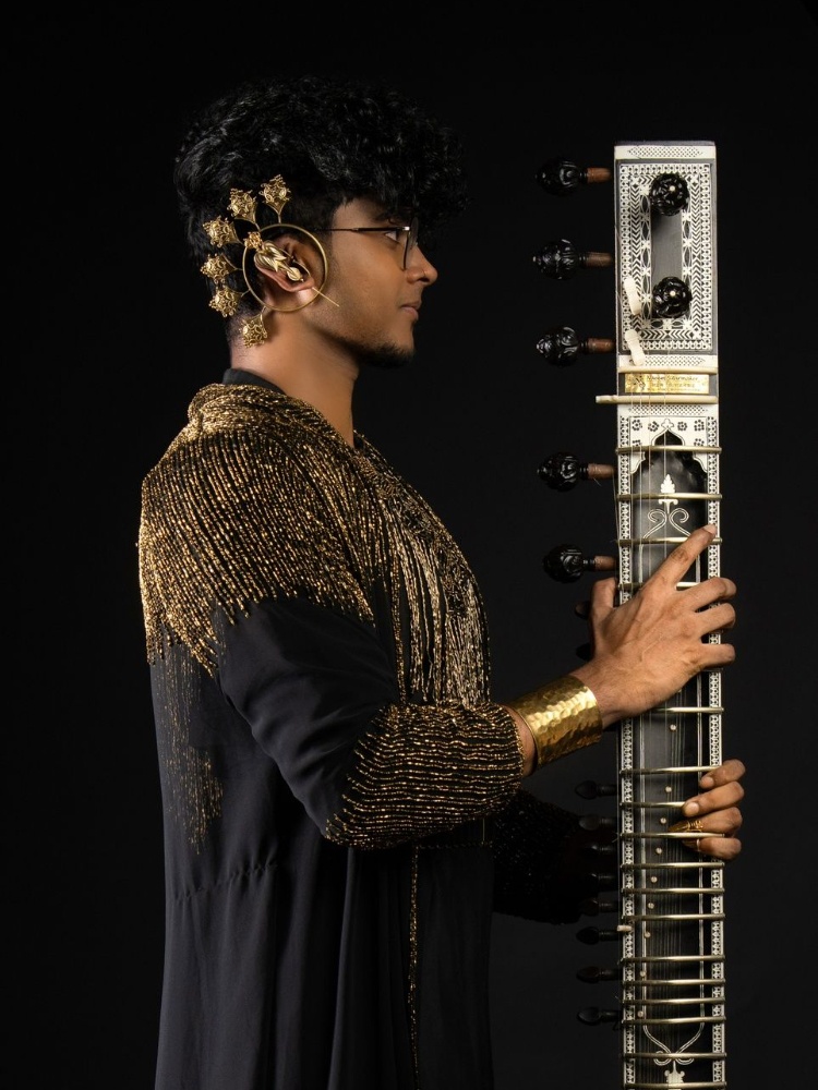 A look he put together himself and his signature ear cuffs