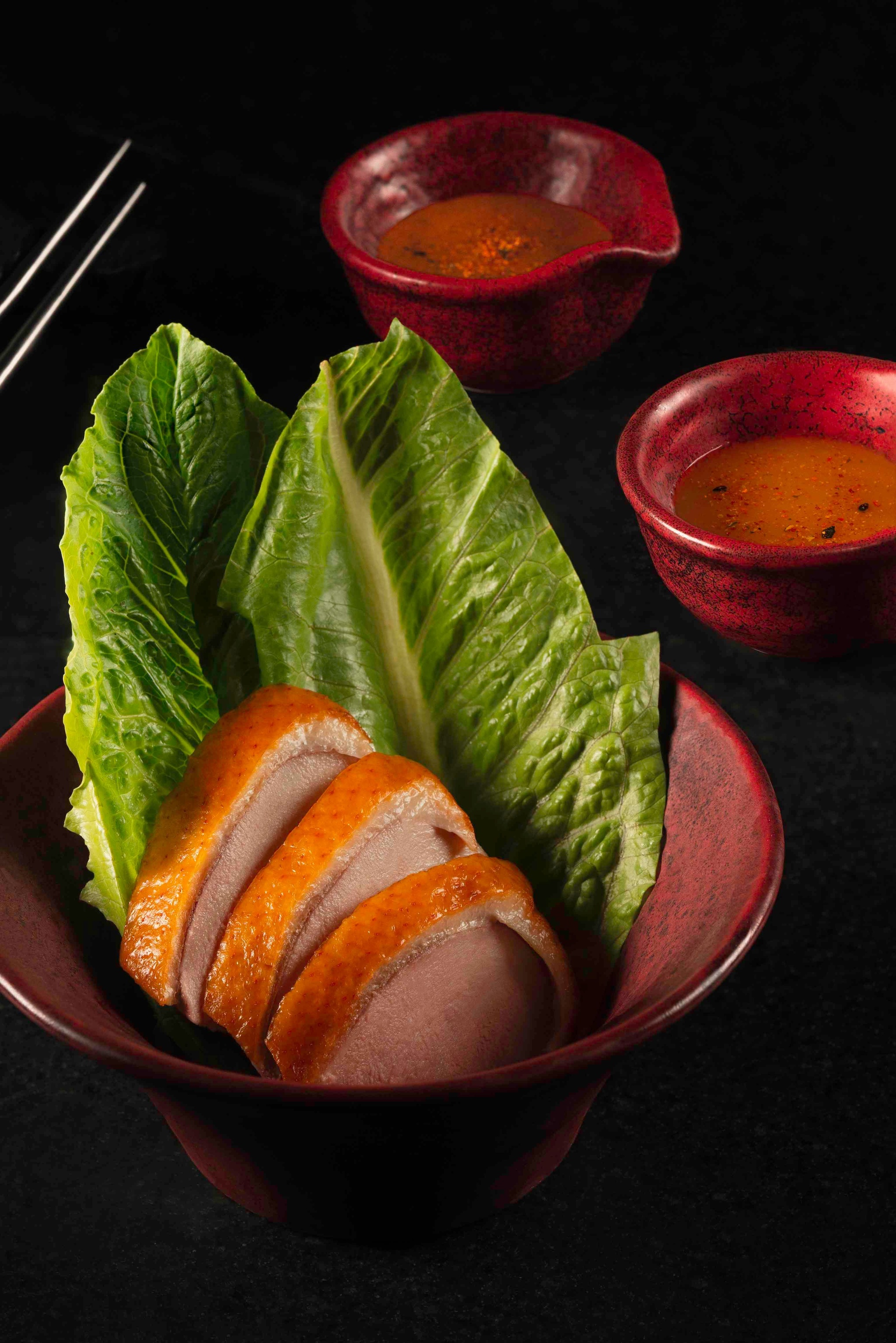 Duck breast course with lettuce wraps and sauces
