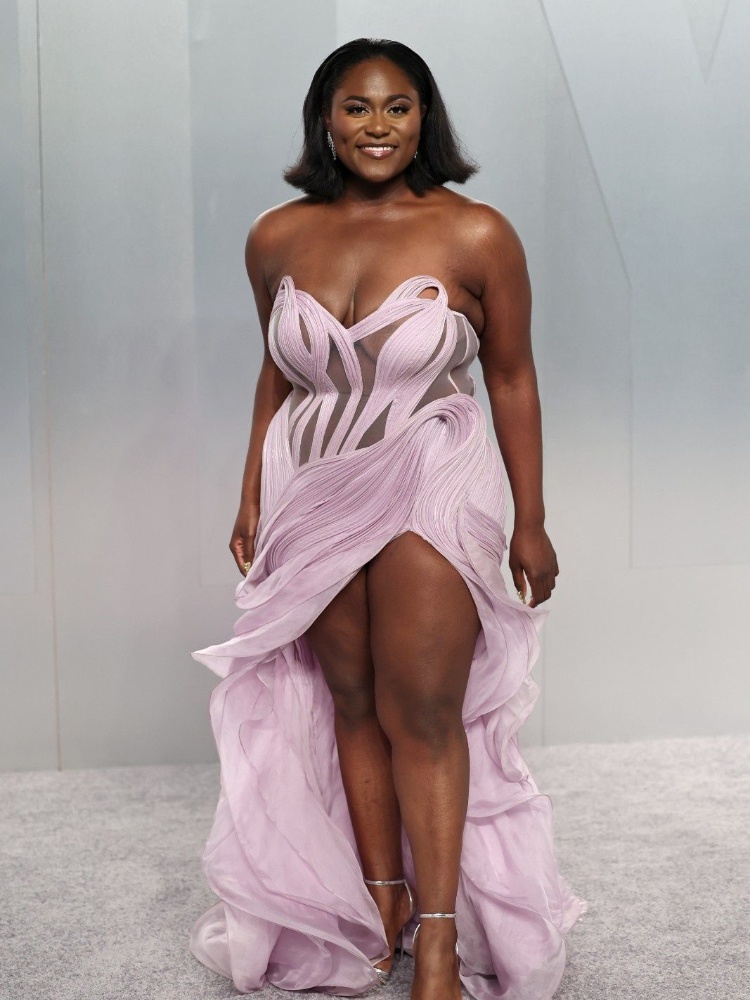 Danielle Brooks in a lilac Gaurav Gupta gown with a sheer bodice and a leg slit at the Vanity Fair Oscar party