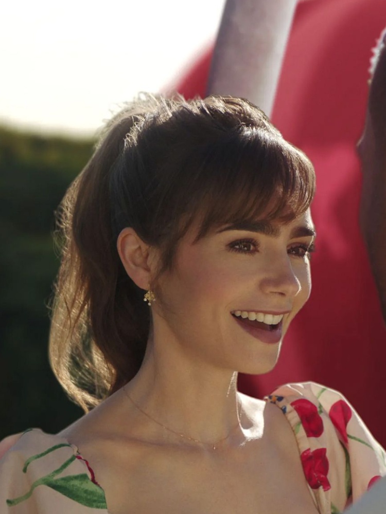 Lilly Collins wears Nue earrings in Emily in Paris