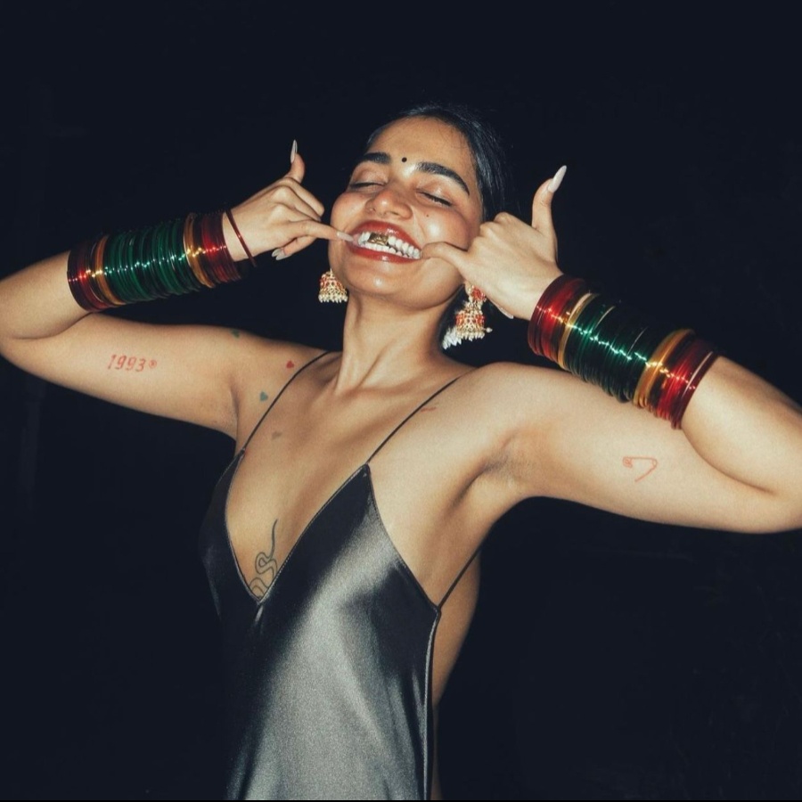 Fashion content creator 'Gayu' Gayathri Mohan wearing custom gold grills by Frostbite Lab